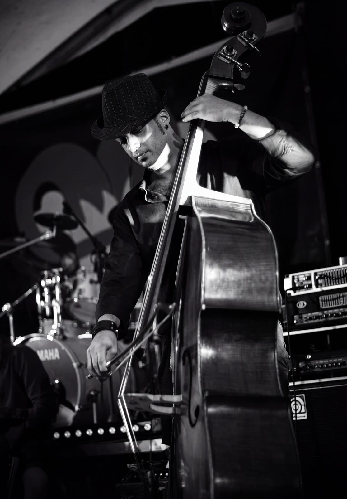 Osman Meyredi bowing the double bass, black and white